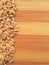 Wheat grain line on wooden background