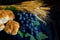 Wheat grapes bread and crown of thorns on black background as a symbol of Christianity