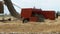 Wheat Harvest. Combine Unloading Wheat into a Tractor Trailer During Harvest.