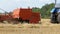 Wheat Harvest. Combine Unloading Wheat into a Tractor Trailer During Harvest.