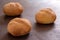 Wheat rolls with lemon flavour on baking tray