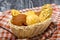 Wheat and rye portioned bread buns in a basket