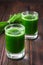 Wheatgrass shot. Juice from wheat grass. Trend of health.