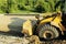 Wheel bulldozer machine for shoveling sand at eathmoving works in construction site