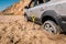 The wheel of the car got stuck in the sand