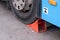 wheel chock under the wheel of the bus. Safety in the operation of public transport