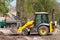 Wheel loader Excavator with back hoe loading sand