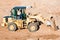 Wheel loader excavator unloading sand