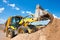 Wheel loader excavator unloading sand