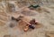 Wheel loader loading sand into dump truck in open pit. Arial view of jaw crusher sand making production line. Heavy mining