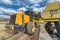 A wheel loader loads sand into a silo.