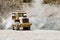 Wheel loader machine loading rocks in the open-mine,