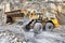 Wheel loader machine unloading rocks