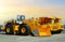 Wheel loader and mining truck. Heavy construction machinery and mining equipment. Front-end loader or all-wheel bulldozer and dump