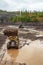 Wheel loader in a mountainous area in an industrial area where minerals are mined.