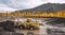 Wheel loader at work. It transports gold-bearing mountain soil to the hopper of the washing device. The gold mining industry