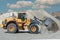 Wheel loaders moving sand in a quarry