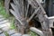 A wheel of an old carriage was half buried in the ground as a decoration, Chengdu,Sichuan,China