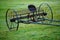 Wheel Rakes on a green grass. Hay Equipment