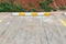 Wheel stop concrete with paint yellow and white of outdoor parking, Rubber Wheel Stopper/Parking space. yellow sign on the road of