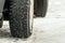 Wheel studded tire on a slippery snowy winter road