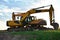 Wheel and tracked heavy excavators working at construction site. hydraulic excavator crane at building site on sunny day