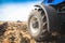 A wheel from a tractor working in the field close up. The concept of agriculture.