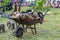 A wheelbarrow full of wooden animals