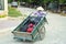 Wheelbarrow hand cart carrier porter wearing vietnamese hat, Vietnam