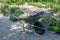 Wheelbarrow with some gardening stuff in a garden