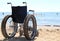 wheelchair aluminum on the sand of the beach