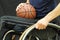 Wheelchair basketball player with ball on his lap