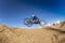 Wheelchair Downhill Rider jumping. Dirt bike weelchair. Disabled Sports