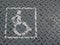 Wheelchair handicap sign lane on grey metal background