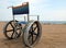 wheelchair with large aluminum wheels to move on the sand of the