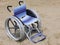 Wheelchair with large perforated lightweight aluminum wheels to