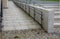 Wheelchair ramp and stairs in the park. a step with a long tread surface overcomes a small elevation. gray railings and granite re