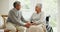 Wheelchair, senior couple and smile in conversation in a retirement home with support and holding hands. Trust, love and