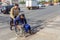 Wheelchair transportation along a pedestrian crossing through the carriageway