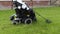 Wheelchair user metal detecting in a field