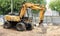 Wheeled excavator on ground