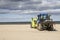 Wheeled tractor for cleaning sand on beach