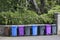 Wheelie bin colour blue, purple and black for refuge collection outside house in a row