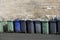 Wheelie bin colour blue, purple and black for refuge collection outside house in a row