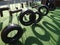 Wheels hanging from chains on playground