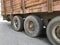 wheels of an old truck with rusty red sides