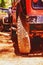 Wheels tires on the off-road in the dust and sand of the desert as a symbol of adventures, travel and rally. Vertical image