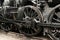 Wheels of vintage steam engine on railway