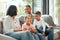 Where love is reciprocated, everyone is a winner. a young family happily bonding together on the sofa at home.