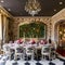 A whimsical Alice in Wonderland-themed dining room with oversized teacup chairs, playing card decorations, and chandelier3